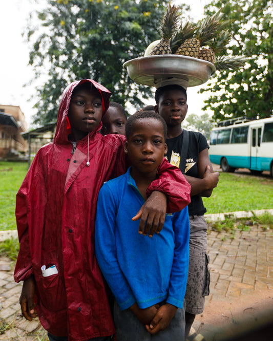 Joyful Bonds: Portrait of Three Boys in Ghana